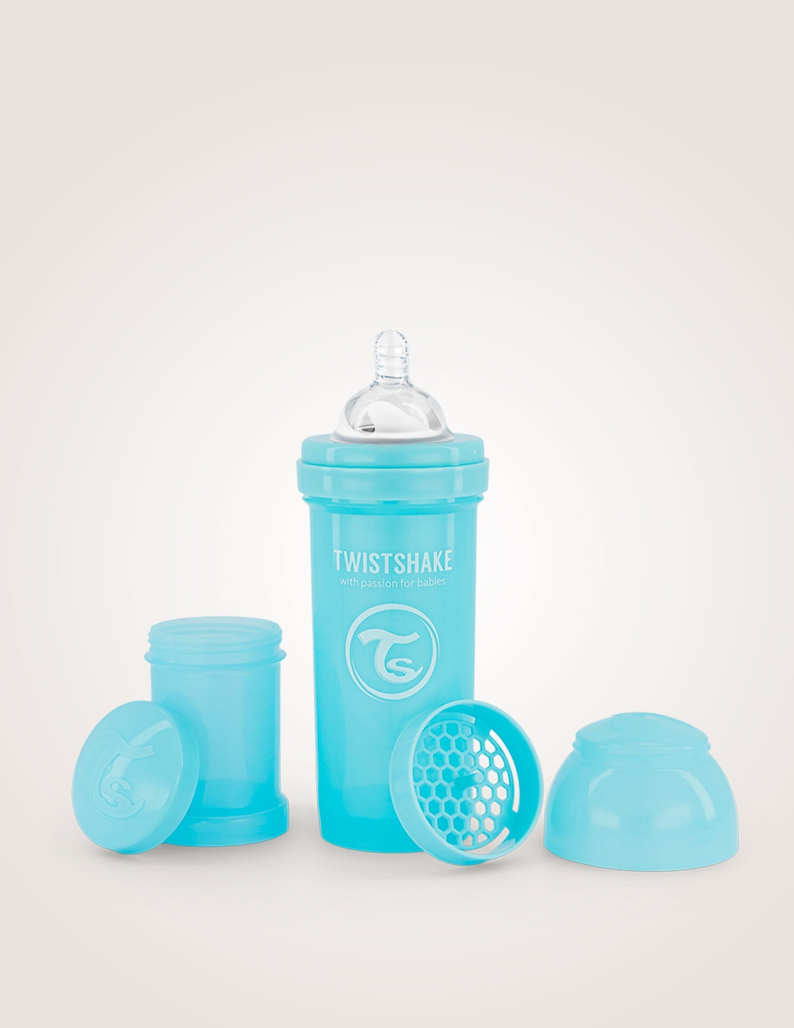 Pastel blue anti-colic baby bottle 260ml, Twistshake with integrated mixer, teat, and stackable powder containers.